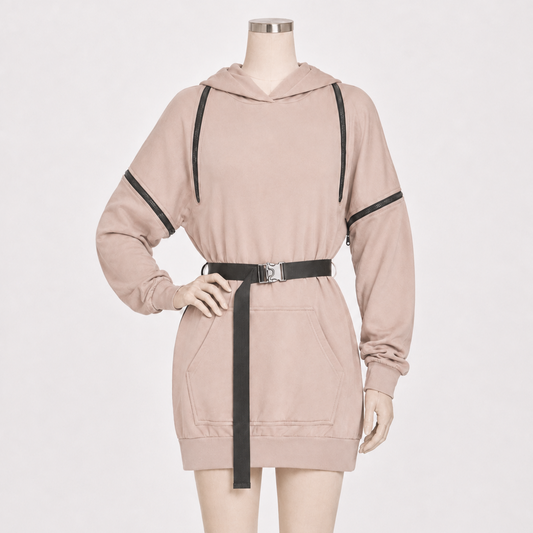 A light beige hooded sweatshirt dress displayed on a mannequin, featuring black contrast straps, a matching black belt with a silver buckle, and black trim details on the sleeves.